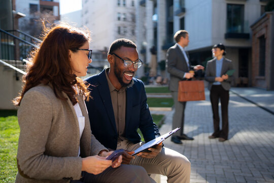 City meeting with coworkers outdoors