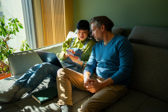 Multi generation professionals working together from home