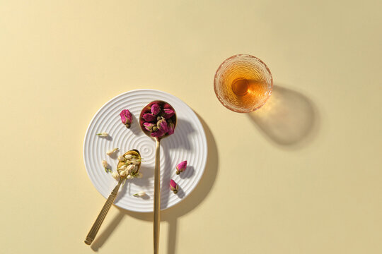 Delicate tea arrangement with rosebuds and jasmine