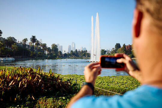 Man takes pictures at Lake Echo Park, Los Angeles