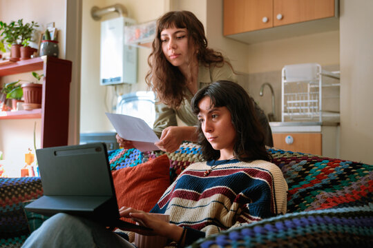 Couple Reviewing Expenses Online