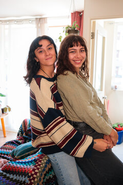 Same Sex Couple Sitting Together at Home