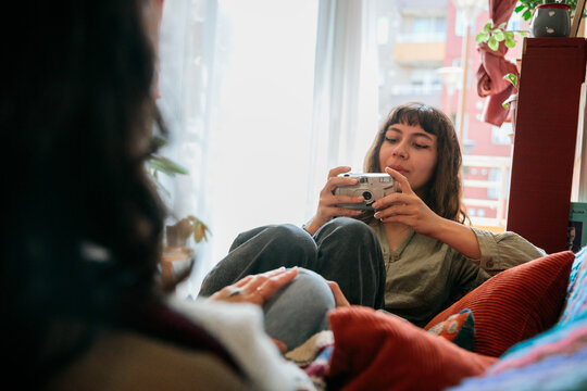 Couple Taking Photos with Compact Camera