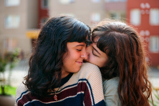 Same Sex Couple Hugging and Sharing an Affectionate Moment