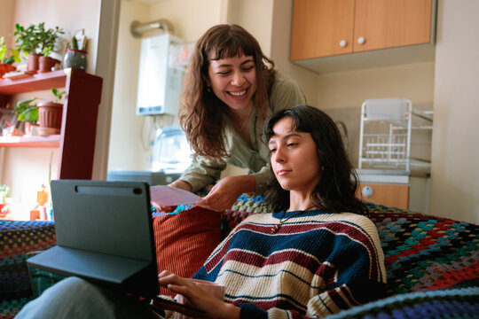 Two Women Reviewing Bills Online