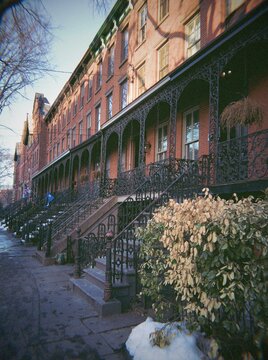 Historic Brick Townhouses with Wrought Iron Staircases