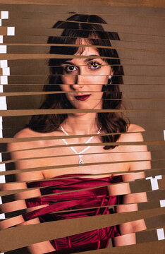Analog collage of a glamorous young womans portrait shredded.