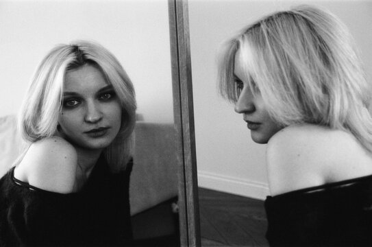 Blonde Woman and Mirror Reflection in B&W Film Portrait