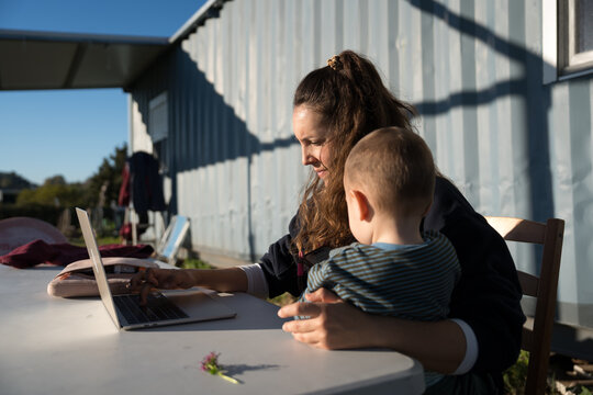 Mother Working With Baby Outside