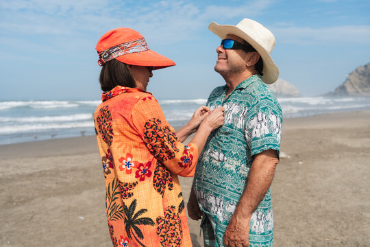 colorful Mature couple on a sunny beach 