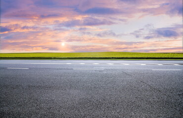 Naklejka premium Road sunset cloud highway landscape nature outdoor travel