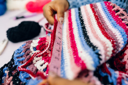 Measuring Crochet Piece with Tape.