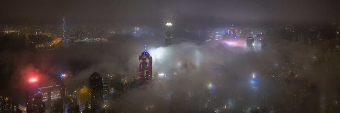 Low Clouds flowing though Hong Kong at night