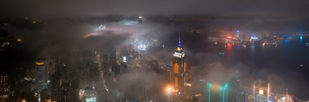 Low Clouds flowing though Wanchai at night Hong Kong