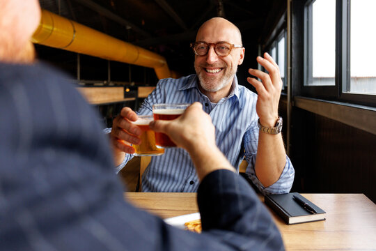 Friends toasting beers