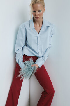 Bold fashion portrait of woman in blue shirt 