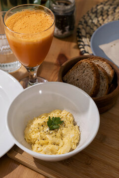 Breakfast With Eggs, Juice, and Bread 