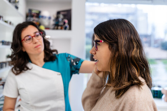 Customer Trying Glasses In Store