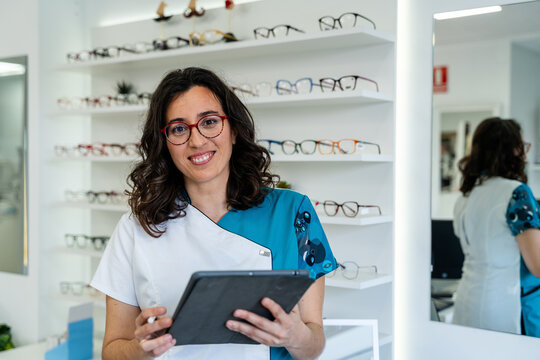 Optometrist Holding Tablet In Store
