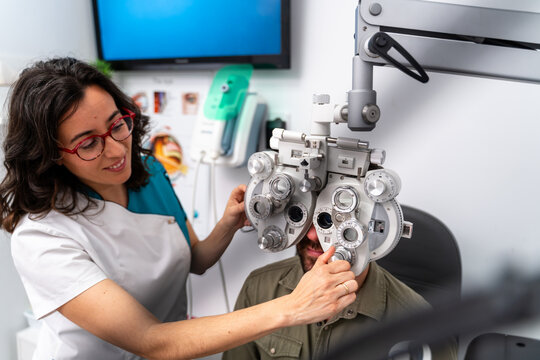 Patient Smiling Behind Phoropter