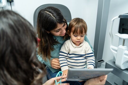 Mother And Toddler Reviewing Tablet