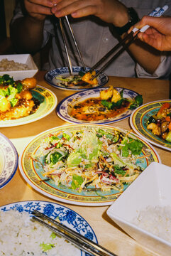 Flash Photography of Asian Food Spread with Chopsticks
