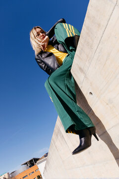 Woman on concrete wall