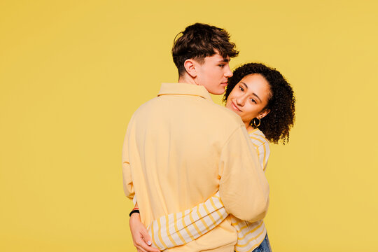 Affectionate couple embracing showing connection in studio