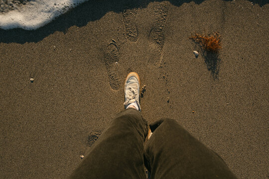 UGC from above of feet by the sea