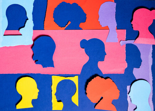 Colorful Silhouettes on Blue Background Made From Paper Cutouts