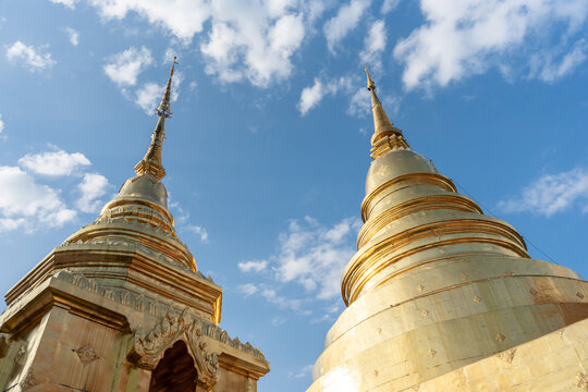 Golden Stupas Under a Blue Sky in Northern Thailand