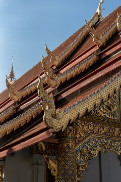 Golden Details on a Temple Roof in Thailand During the Daytime
