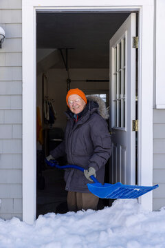 Portrait senior man snow storm shovel 