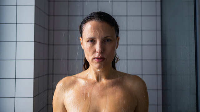 Portrait Of Woman Standing Under Shower Water