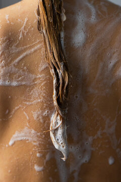 Lathered Wet Hair Dripping Over Bare Back While Showering