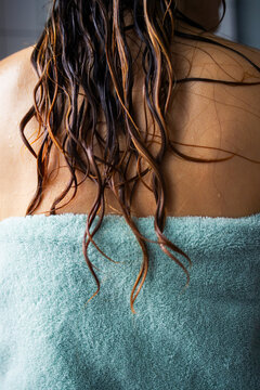 Wet Hair On Towel Draped Over Woman's Back