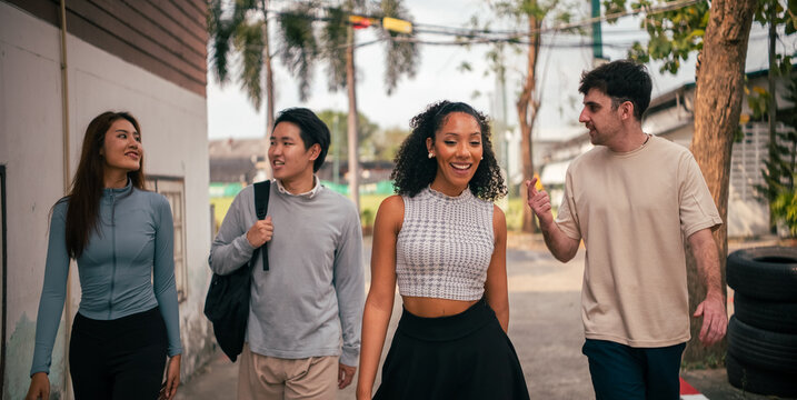 Diverse students walking to or from sports court laughing