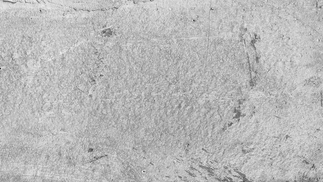 Close-up of a rough concrete wall texture with subtle lines