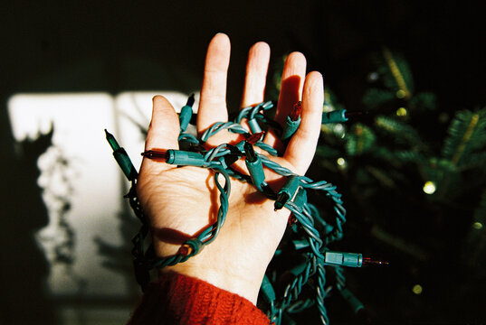 Film Photo of Hand with Christmas Lights