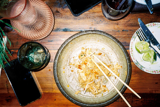 Plate of Pad Thai Noodles on a Restaurant Table