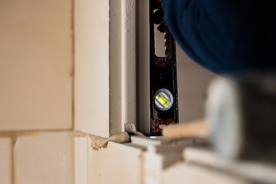 Checking Wall Alignment with Spirit Level