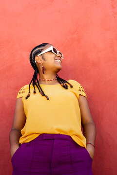 Stylish Afro-Brazilian Woman Posing in Mustard Yellow and Purple