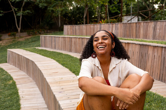 Laughing Woman on Wooden Terraced Seating