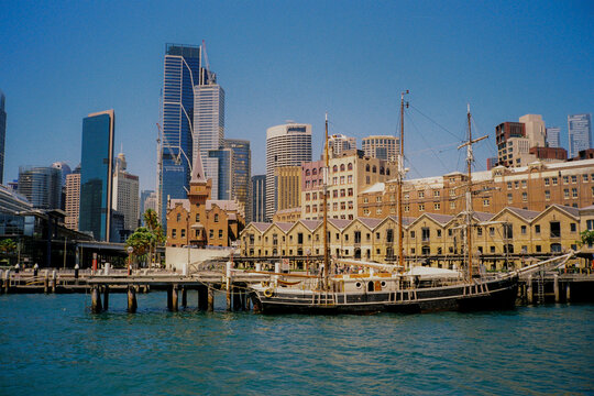 Sailing ship in a busy harbour in Sydney, shot on film 