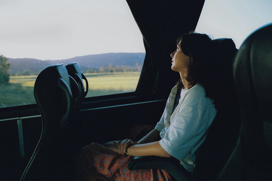 Woman traveling by bus through rural Australia 
