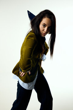 Woman in modern attire posing in studio