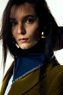 Beautiful woman facing the camera in studio