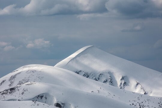 A cinematic winter mountain series capturing ski touring moments 