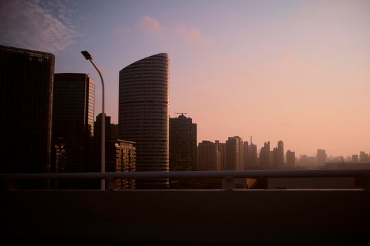 City Skyline at Sunset With Tall Buildings and Highways