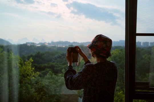 Person Takes a Picture of Nature View From the Window